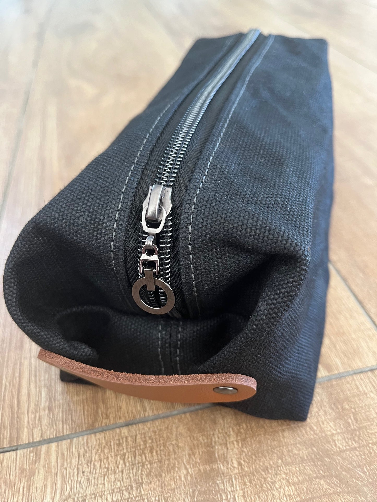 Black waxed canvas wash bag